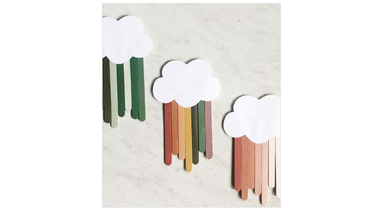 rainbow colored craft sticks under a white paper cloud