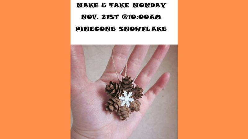 DIY snowflake made from pinecones held in the palm of someone's hand