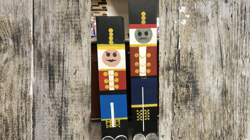 holiday decoration: long wood boards painted in the shape of the nutcracker