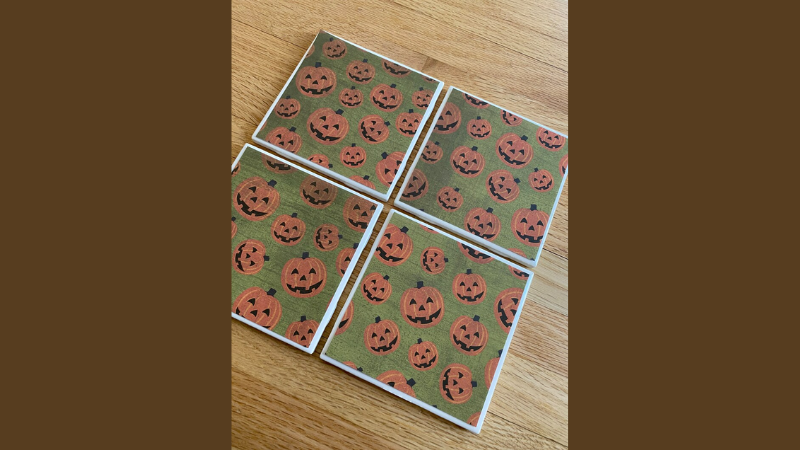 square coasters with jack-o-lanter patterns